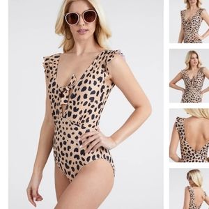 Never worn. Leopard print one piece swimsuit.